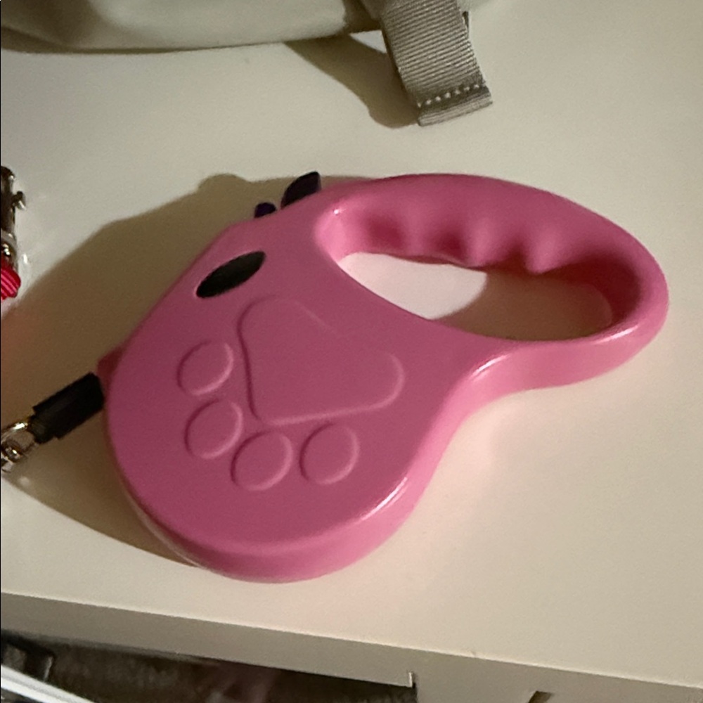 1 Pink Retractable Dog Leash 16ft
1 red 6 ft leash in great condition-